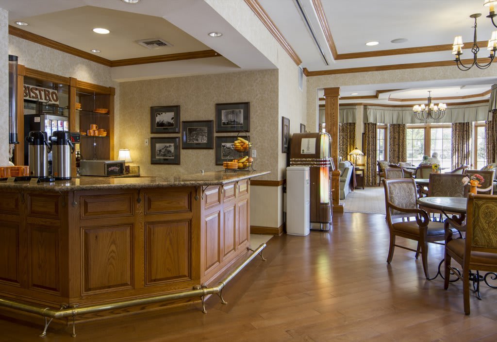 A cozy hotel reception area with wooden furniture and tasteful decor.