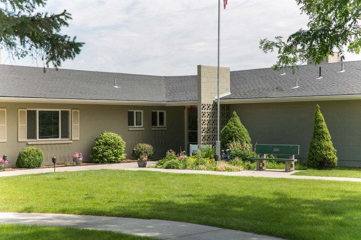 A modern residential house with a well-maintained lawn and garden.