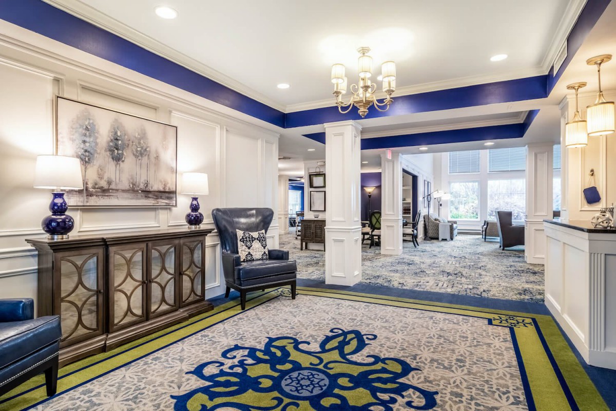 A luxurious hotel lobby with elegant furnishings and decorative elements.