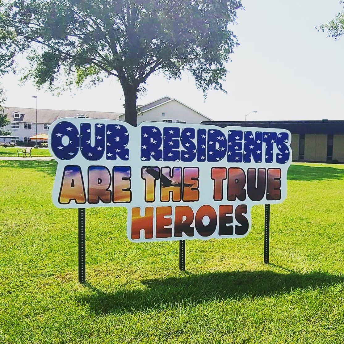 Outdoor sign appreciating residents as true heroes.
