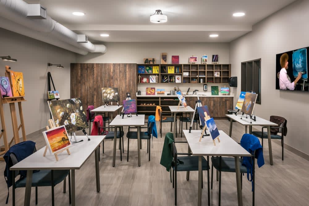 An art studio setup with easels and canvases ready for a painting class.
