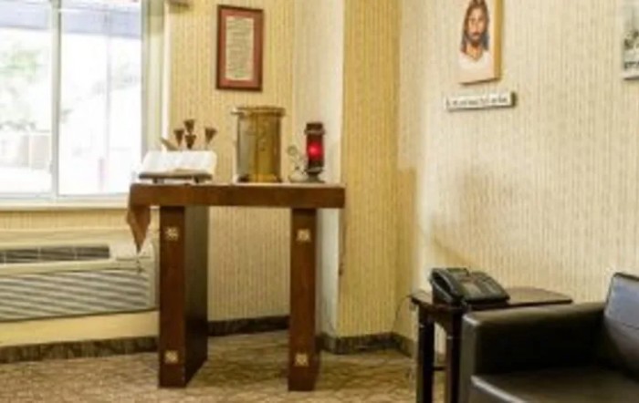 A small chapel area with an altar and religious symbols.