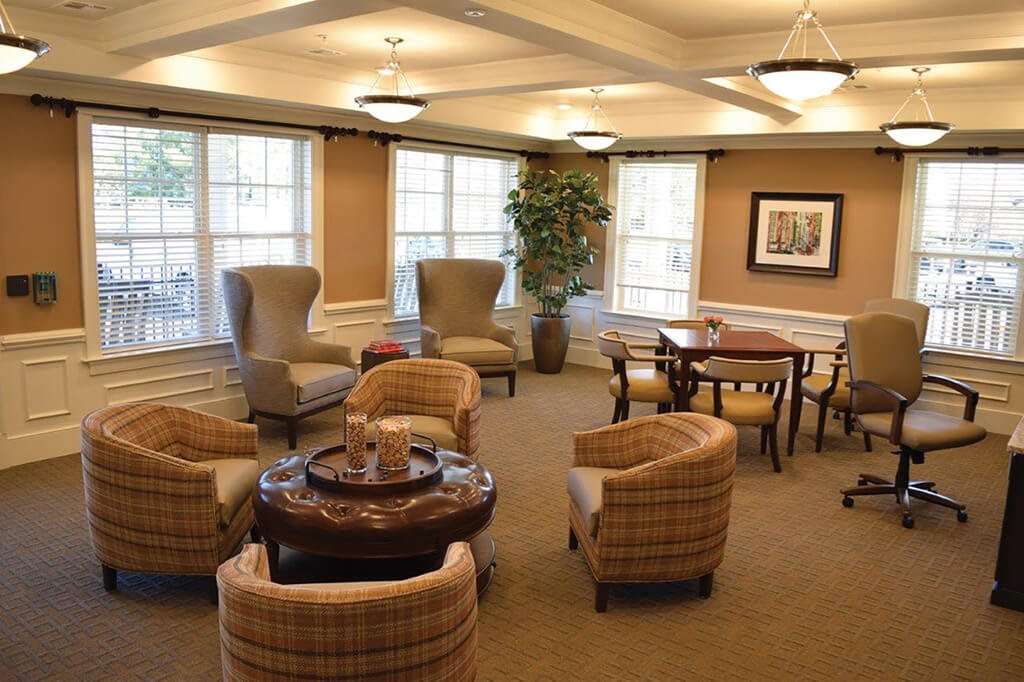 A cozy lounge area with comfortable seating and soft lighting, perfect for relaxation.