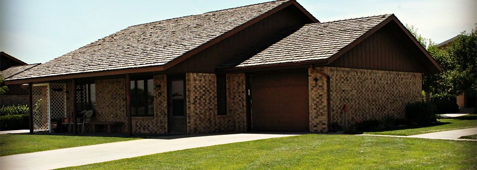 A single-story brick house with a garage.