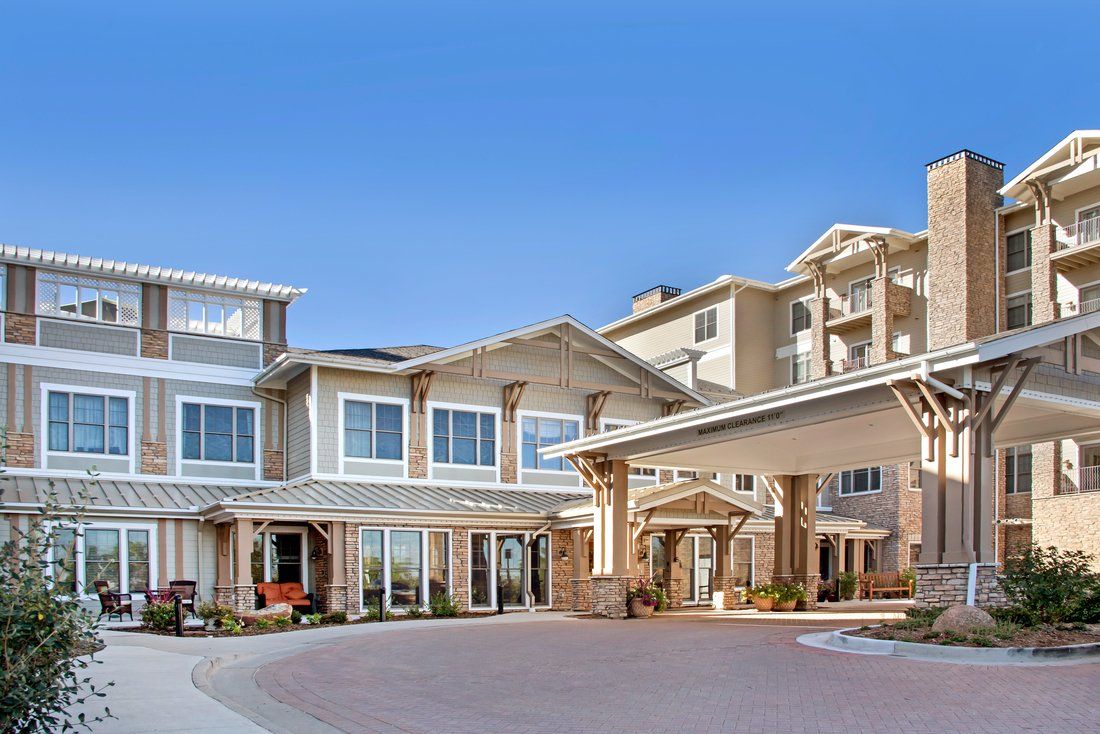 A modern residential building with a welcoming entrance and multiple stories.