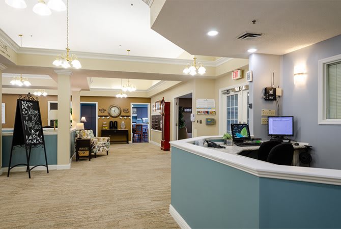 A modern reception area with comfortable seating and elegant lighting.