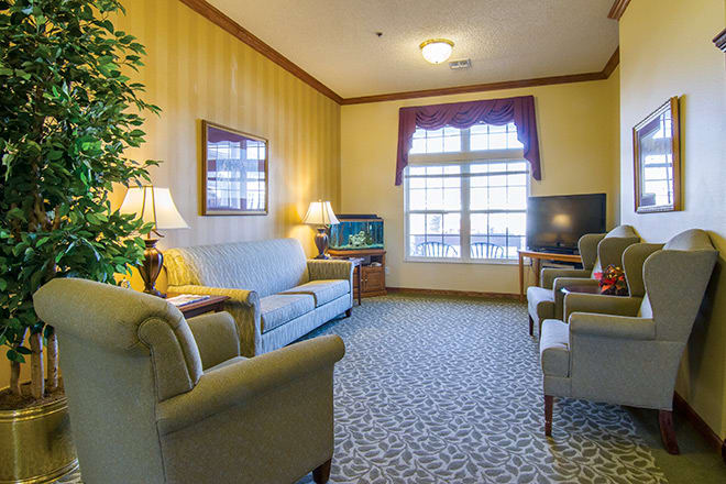 A cozy living room with comfortable seating and natural light.