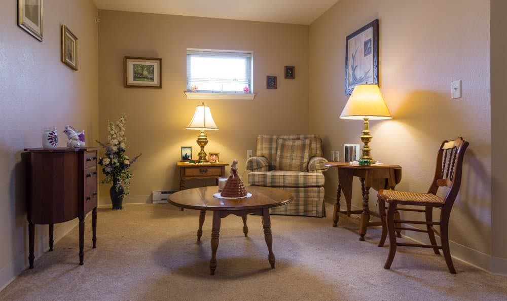A cozy living room with comfortable seating and warm lighting.