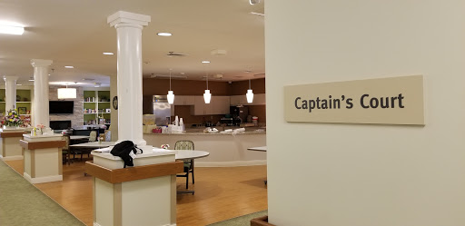 A view of a dining area with a prominent sign labeled 'Captain'.