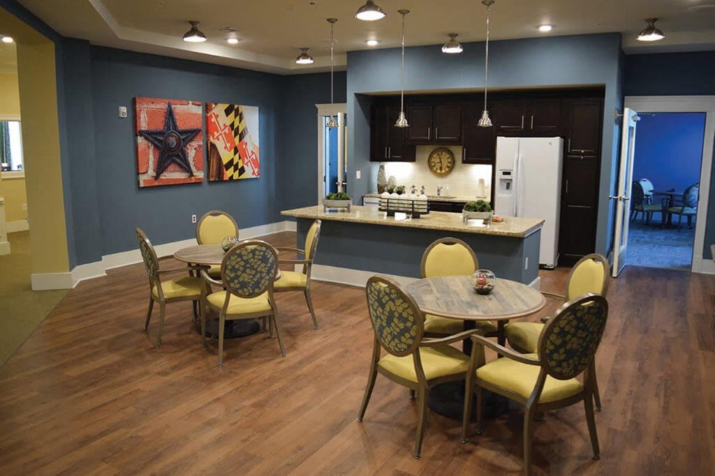 A modern kitchen and dining area with stylish decor and comfortable seating.