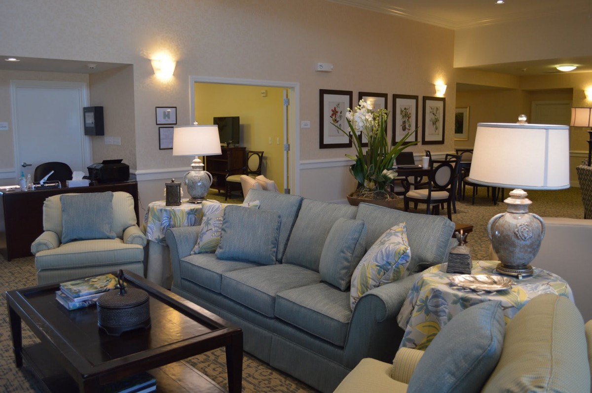 A cozy living room with comfortable seating and warm lighting.
