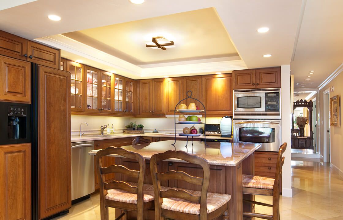 Elegant kitchen with wooden cabinets and a central island.