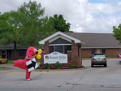 A person in a dinosaur costume holding balloons and a sign outside a building.