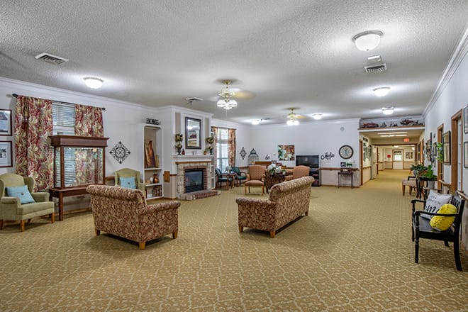 A cozy living room with comfortable seating and a fireplace.