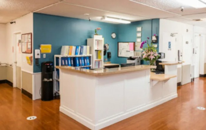 A well-organized reception area with a desk and various office supplies.
