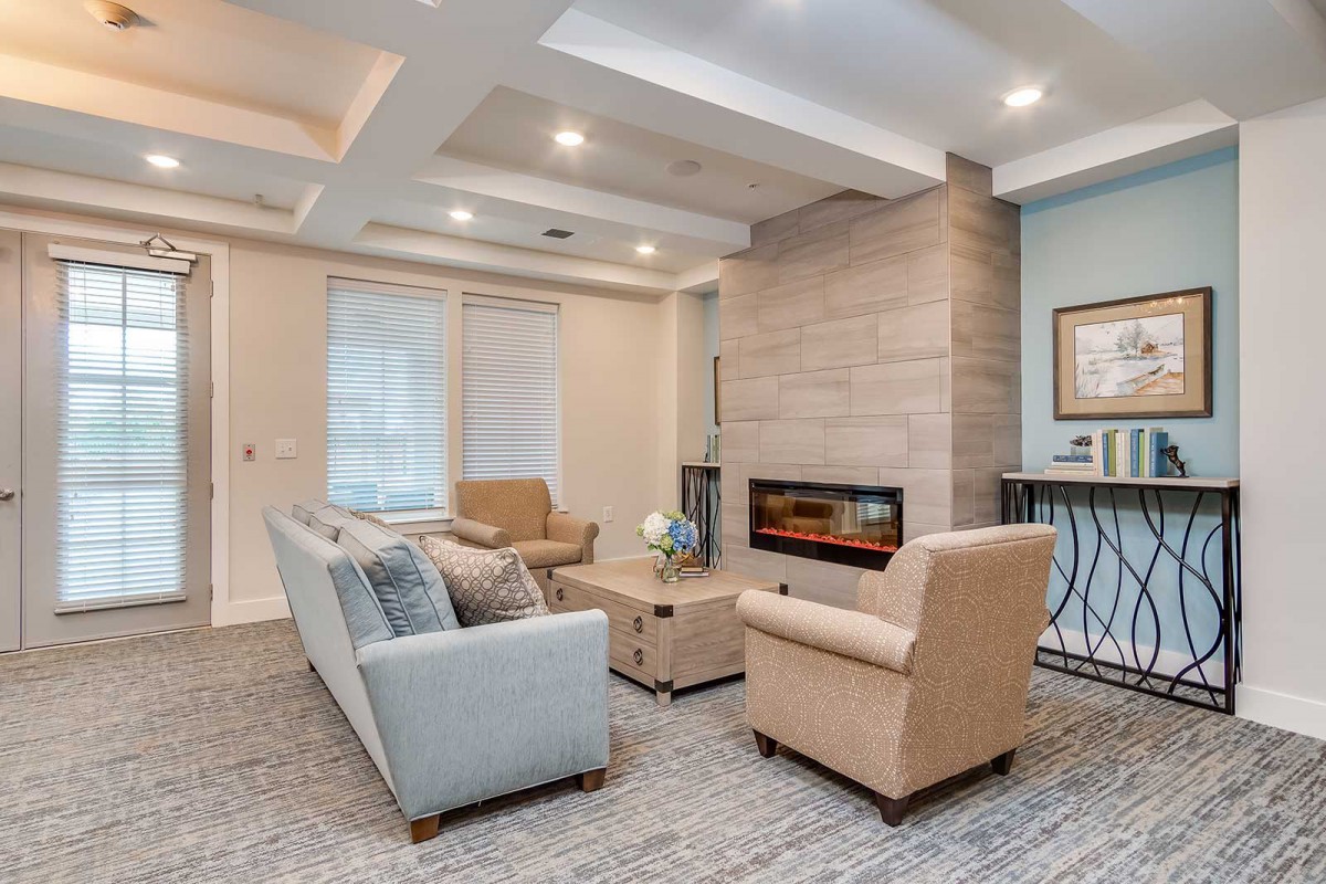 A modern living room with a contemporary fireplace and comfortable seating.