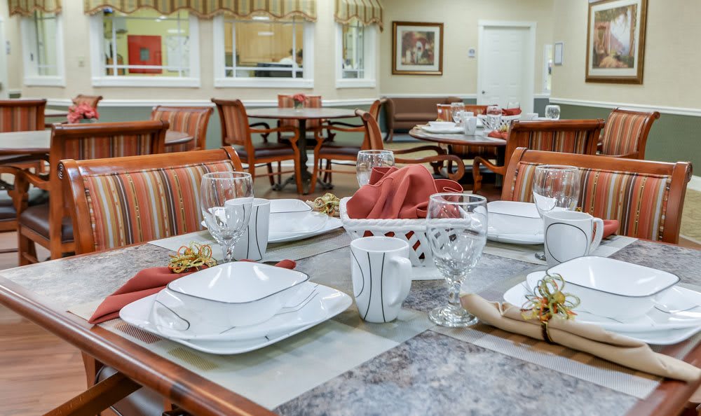 A well-set dining table in a cozy restaurant or dining area.