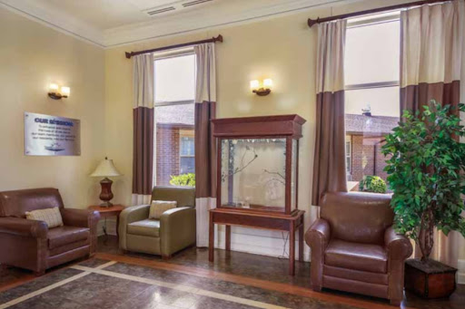 A cozy living room setup featuring comfortable seating and elegant decor.