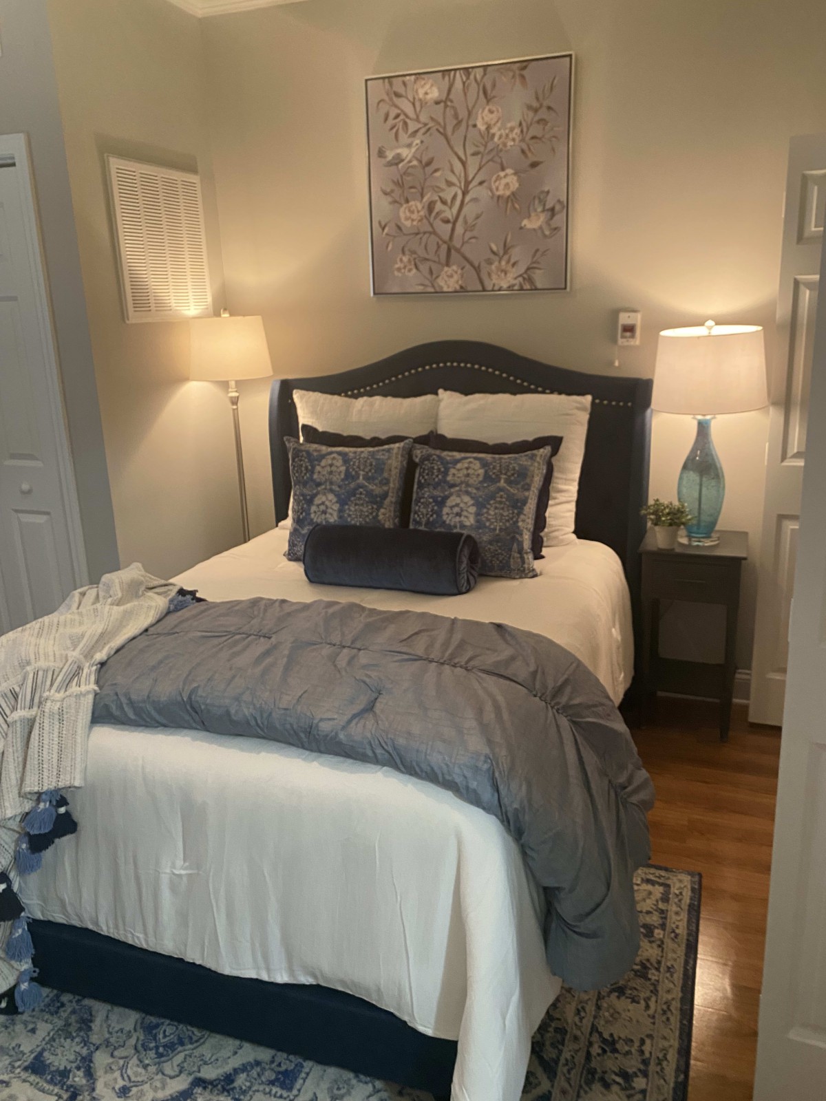 A cozy and stylish bedroom with elegant decor and soft lighting.