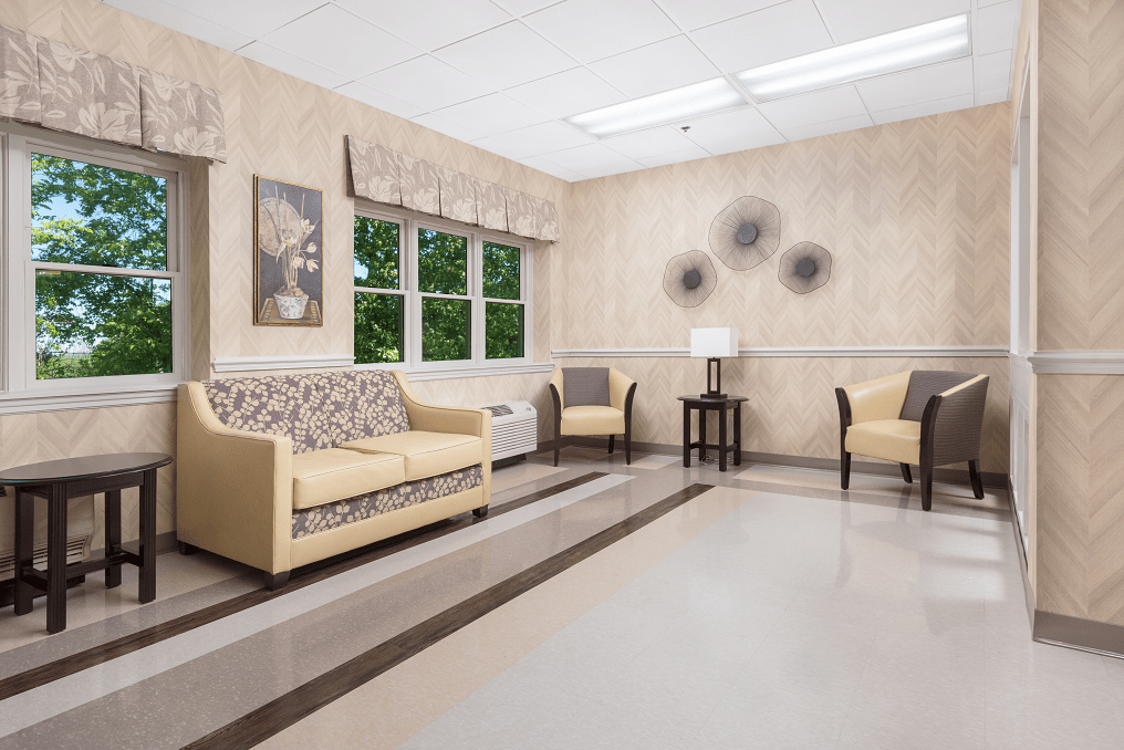 A well-lit waiting room with comfortable seating and decorative artwork.