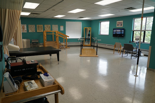 A well-equipped physical therapy room designed for rehabilitation activities.