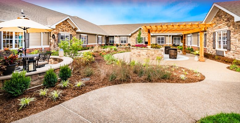 A well-maintained courtyard with lush greenery and modern architecture.