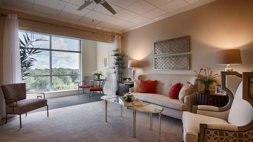 A beautifully designed living room featuring modern decor and a bright window view.