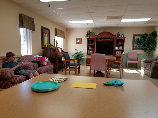 A cozy lounge area designed for relaxation and socialization in a senior living community.