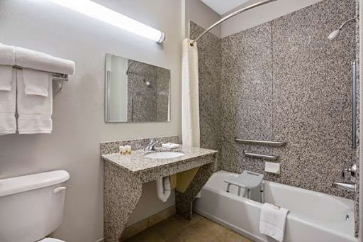 A modern bathroom featuring a shower, sink, and bathtub.