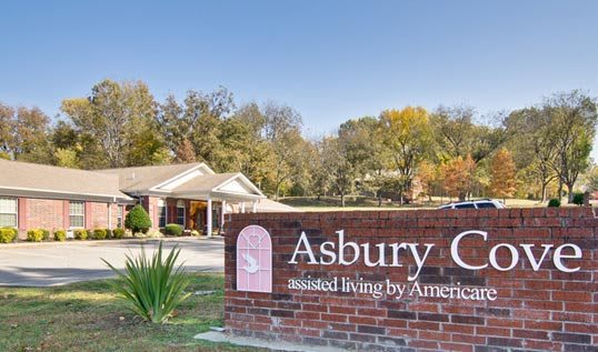 Entrance sign for Asbury Care assisted living facility.