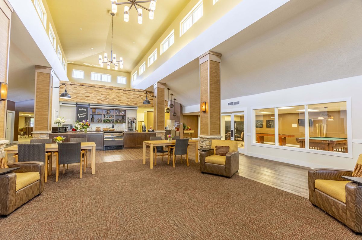 A spacious and well-lit lobby with comfortable seating and modern decor.