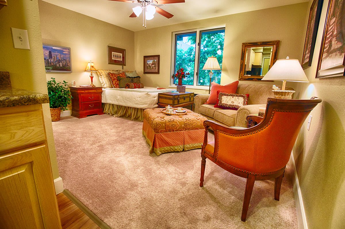 A cozy living room featuring warm lighting, comfortable furniture, and tasteful decor.