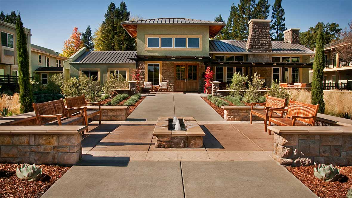 A modern home with an inviting outdoor patio and landscaped garden.