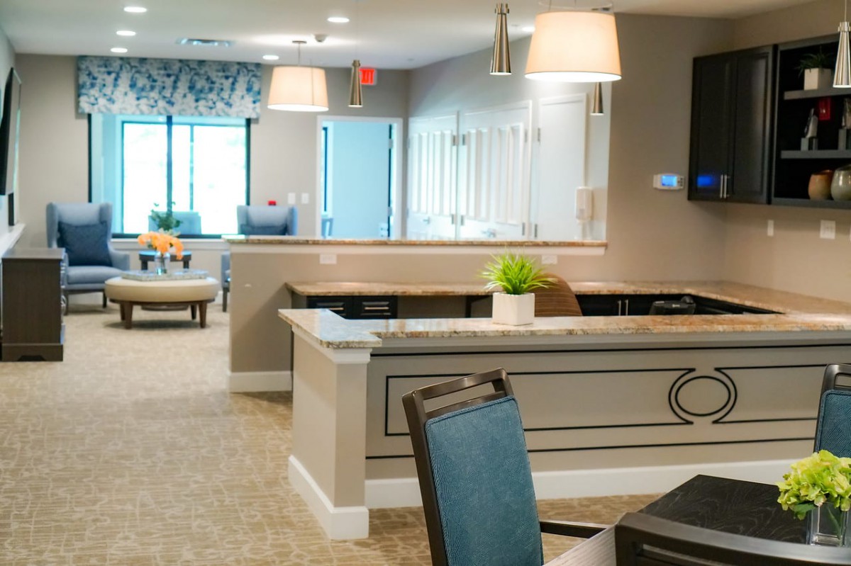 Modern lobby area with a reception desk and elegant lighting.