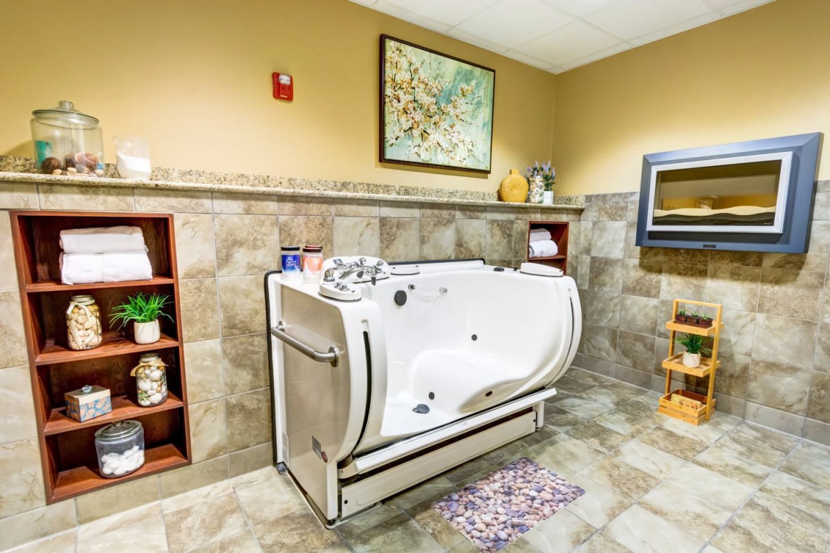 A luxurious bathroom with a modern spa tub and elegant decor.