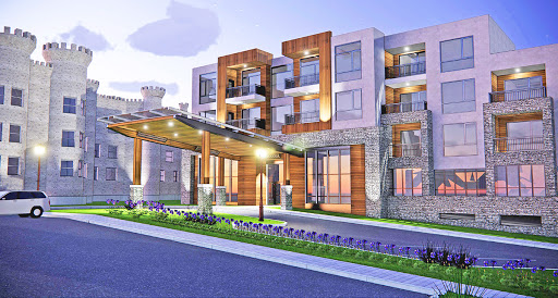 A contemporary residential building showcasing a blend of modern architectural elements and landscaped surroundings.