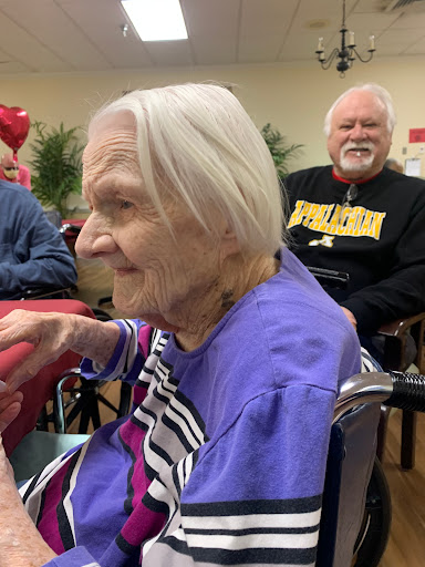 A joyful moment shared among seniors, showcasing the warmth and connection in their community.