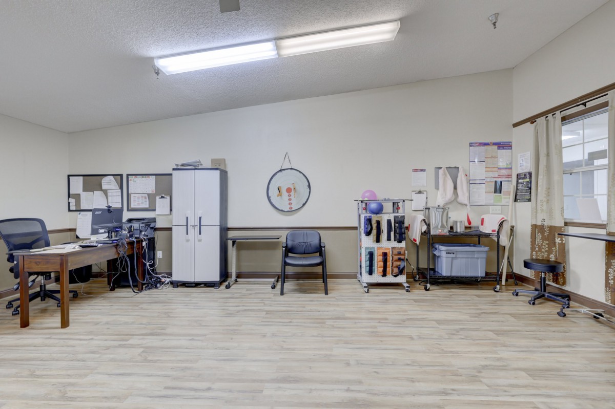 A well-organized office space with storage cabinets and chairs.