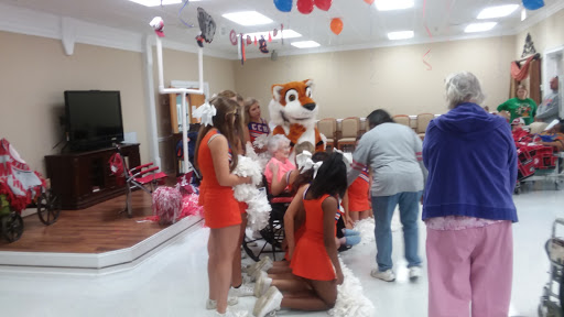 A lively community event featuring cheerleaders and a cheerful mascot, bringing joy to participants.