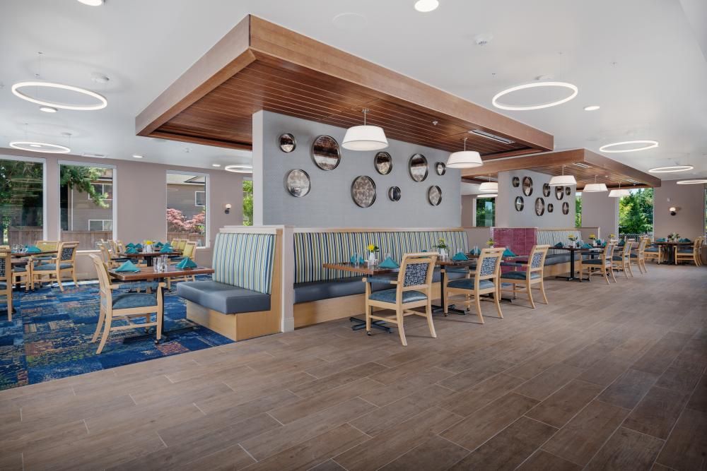 A modern restaurant interior featuring booth seating and stylish decor.
