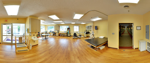 A well-equipped physical therapy room designed for rehabilitation and exercise.