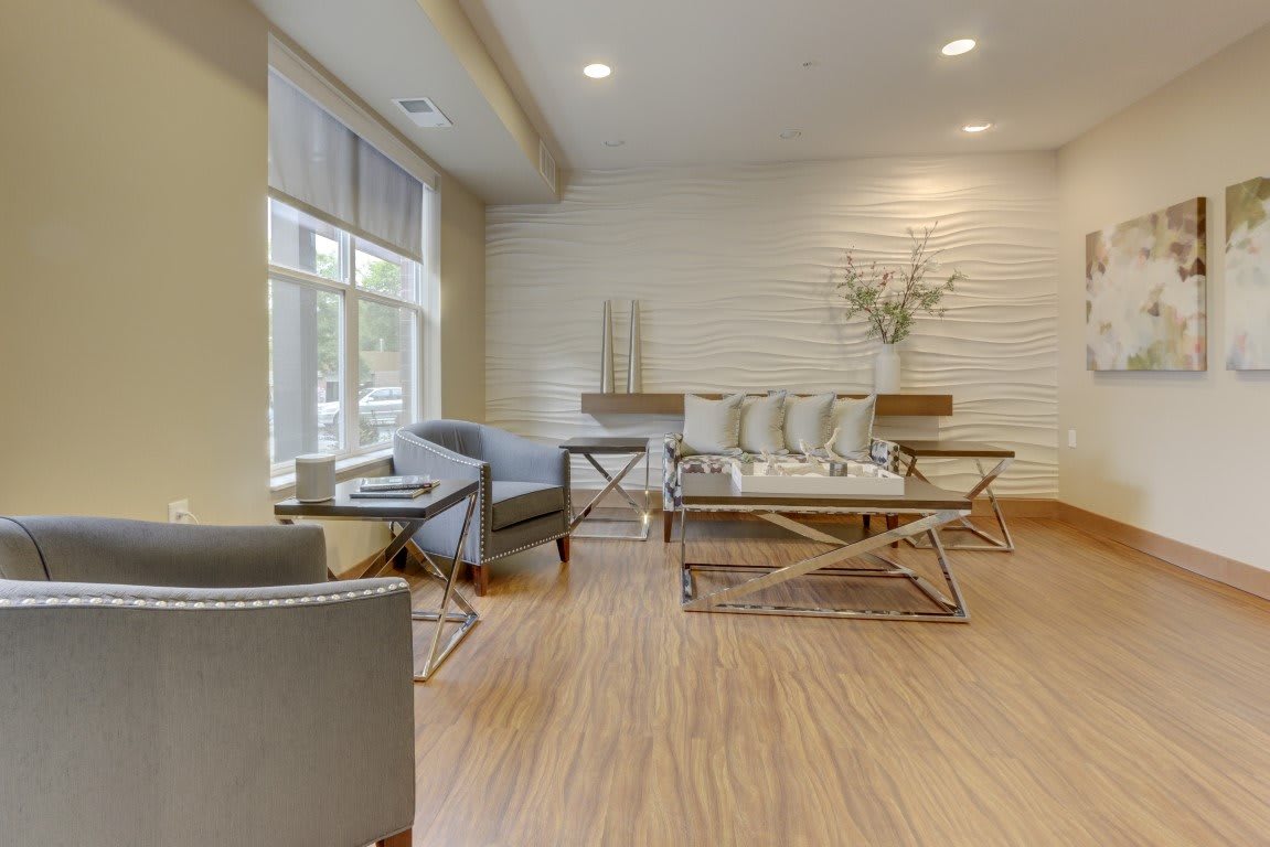 A modern living room with contemporary furniture and neutral tones.