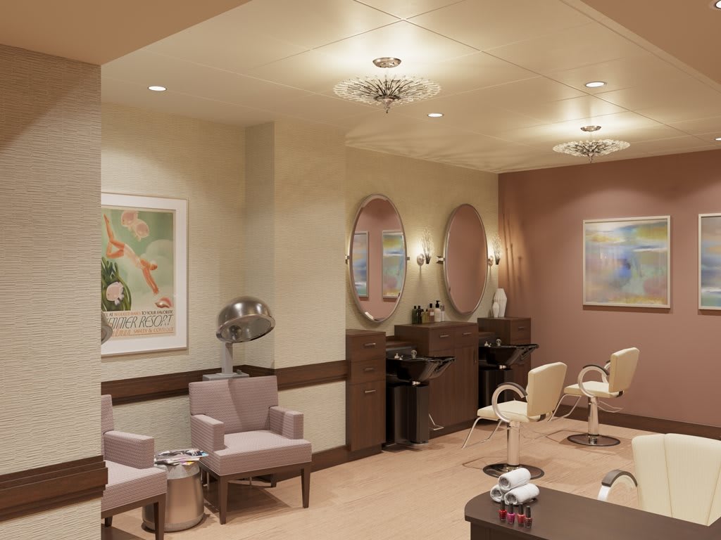 A cozy salon interior featuring chairs, mirrors, and wall artwork.