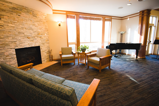 A cozy and inviting living room with ample natural light and stylish furnishings.