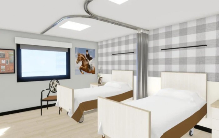 A hospital room with two beds, featuring a plaid wallpaper and a large window.