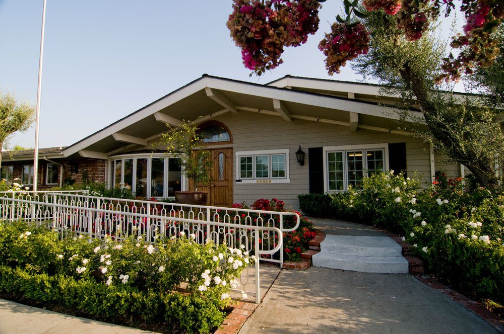A charming bungalow with a well-maintained garden and inviting front porch.
