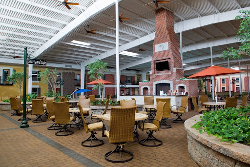 A cozy indoor dining area featuring a large fireplace, perfect for casual gatherings.