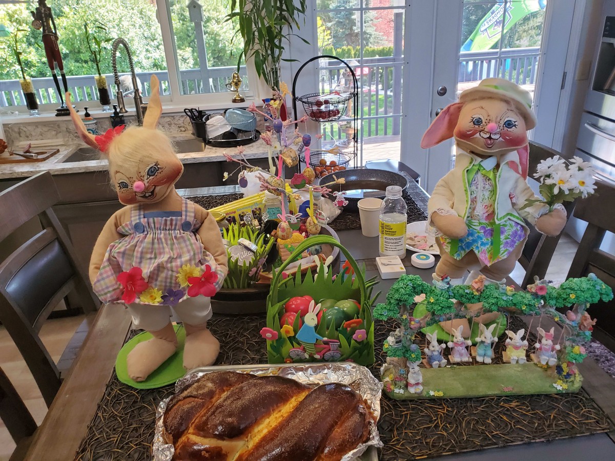 Festive Easter decorations with bunnies and baked bread in a kitchen setting.