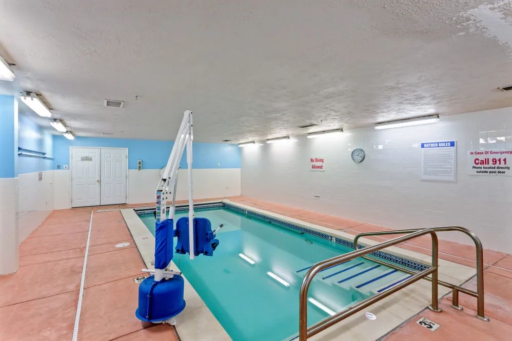 An indoor pool equipped with a lifting device for accessibility.