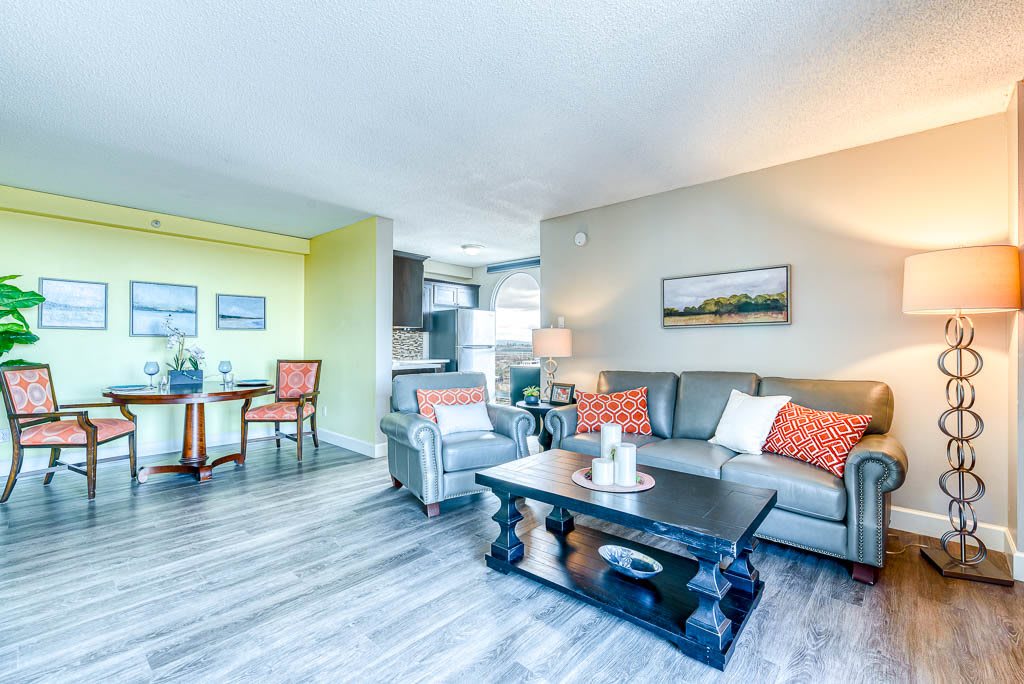 A modern living room with stylish furniture and bright accents.